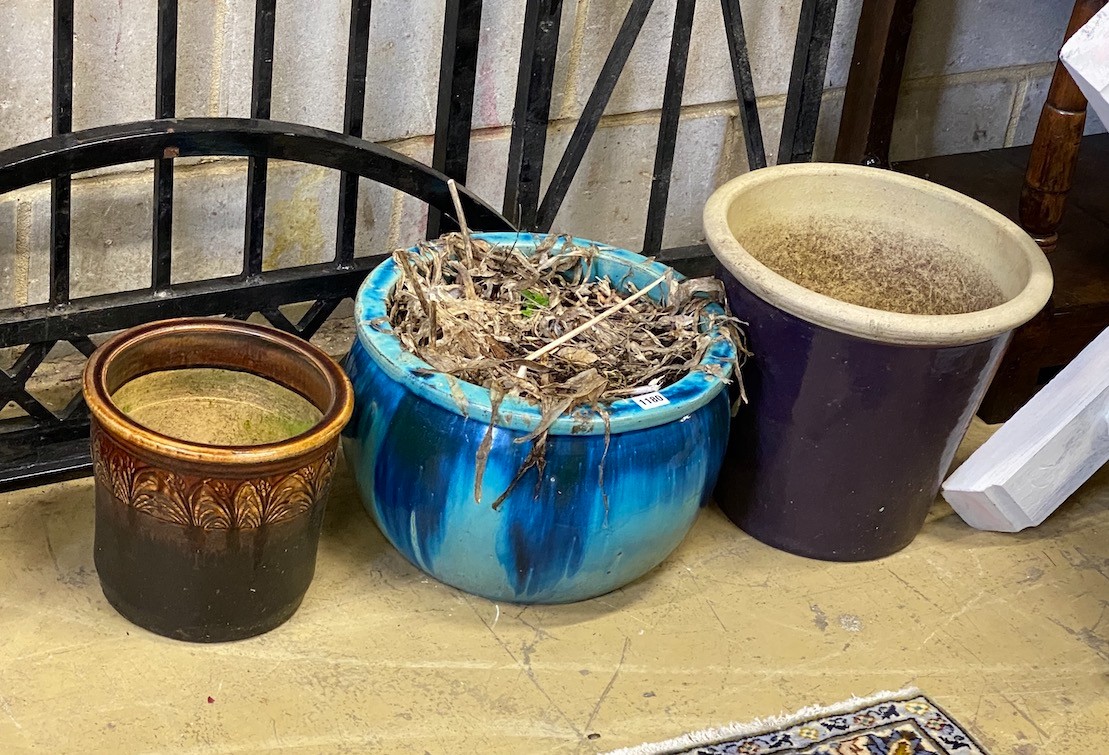 A collection of seven assorted composition and pottery garden planters, largest diameter 50cm, height 38cm